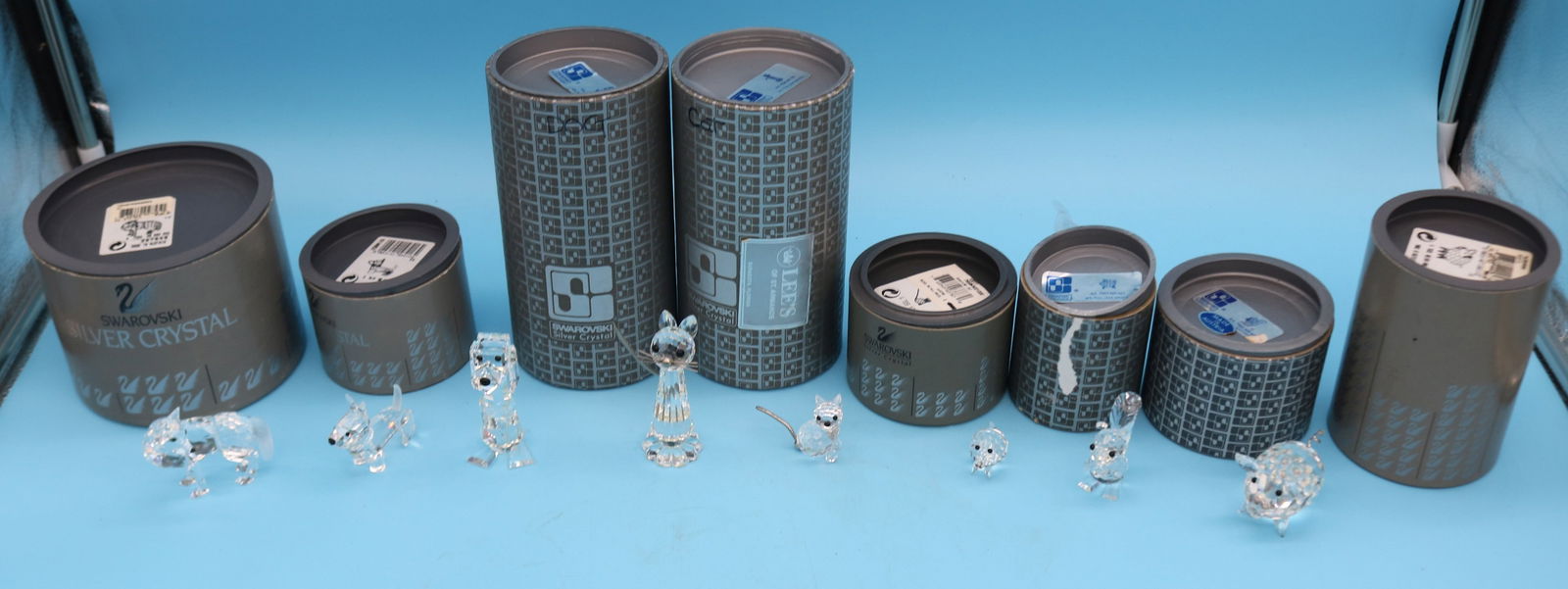 COLLECTION OF 8 SWAROVSKI CRYSTAL FIGURES IN: ORIGINAL CONTAINERS, DOGS, CATS, PIGS, SQUIRREL 3/4" H - 3" H, 1" - 2 1/4" W