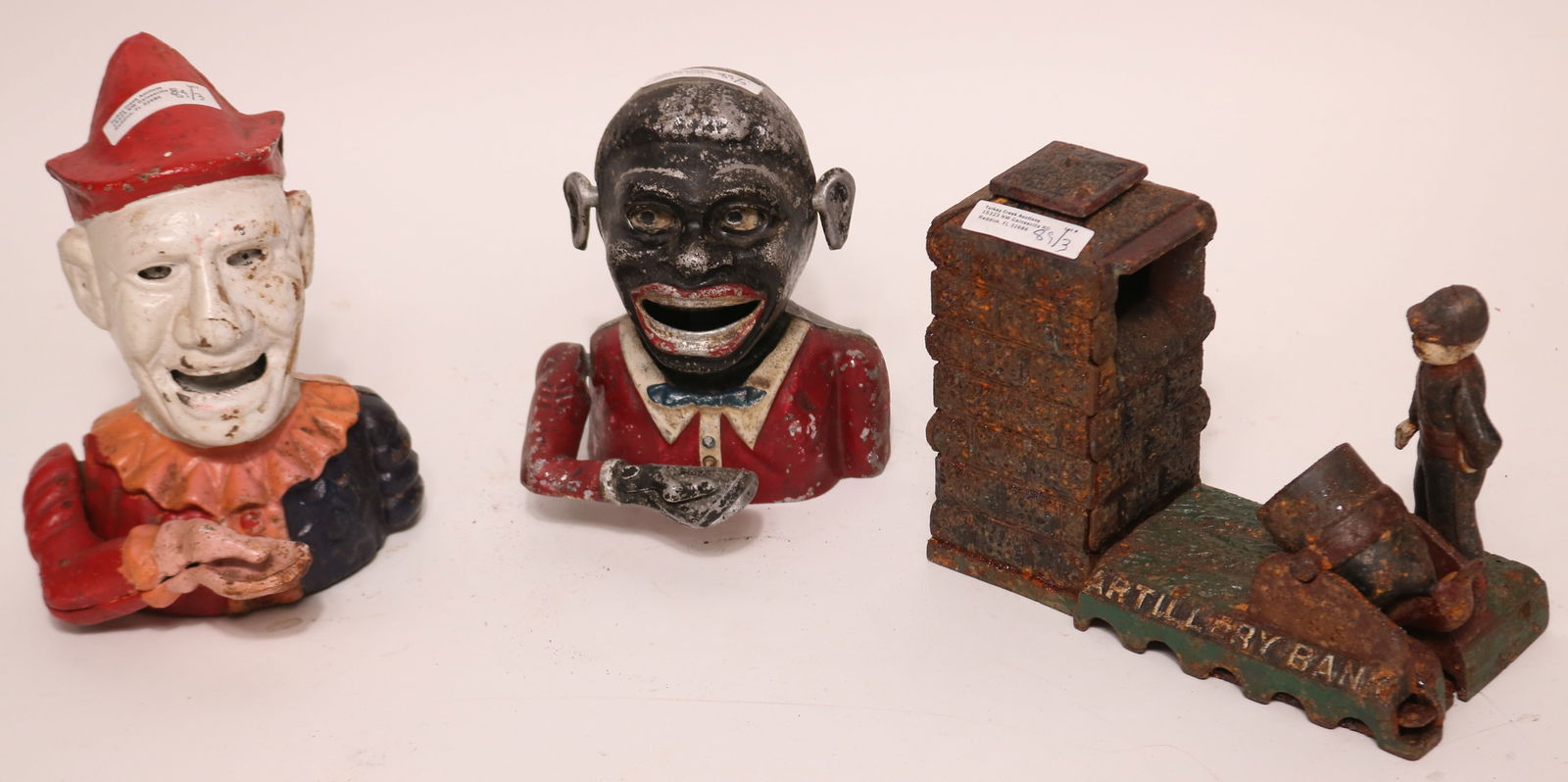 3 MECHANICAL BANKS, MID TO LATE 20TH C., ALUMINUM: BLACK MAN, CAST IRON CLOWN, ARTILLERY BANK, WORN PAINT, 6 1/4" - 7 1/2" H