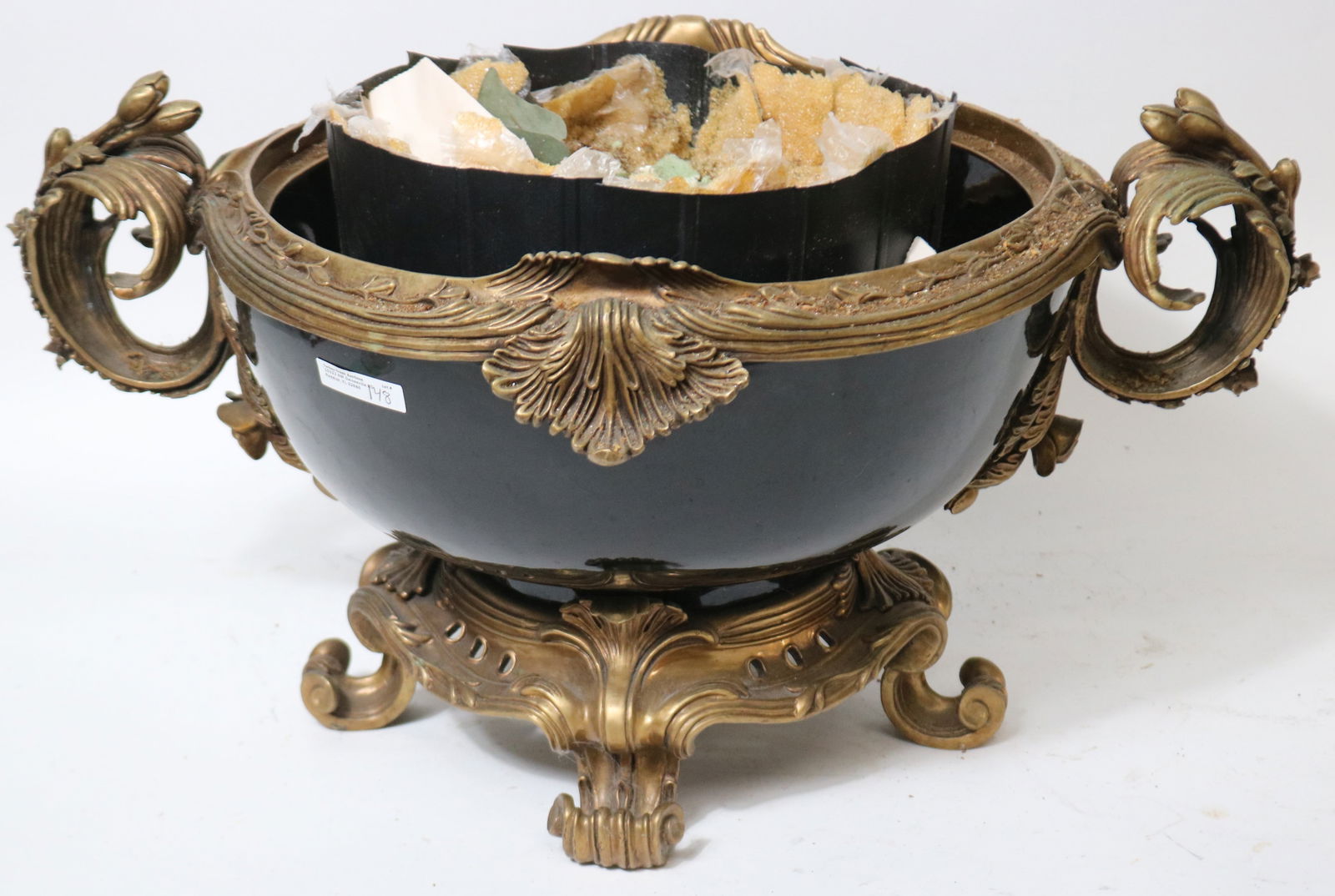 LARGE CONTEMPORARY BRONZE MOUNTED PORCELAIN BOWL,: ORANE HANDLES & BASE, PLANTER STUCK TO INTERIOR, 12" H, 23 1/2" W, 15" DIA.