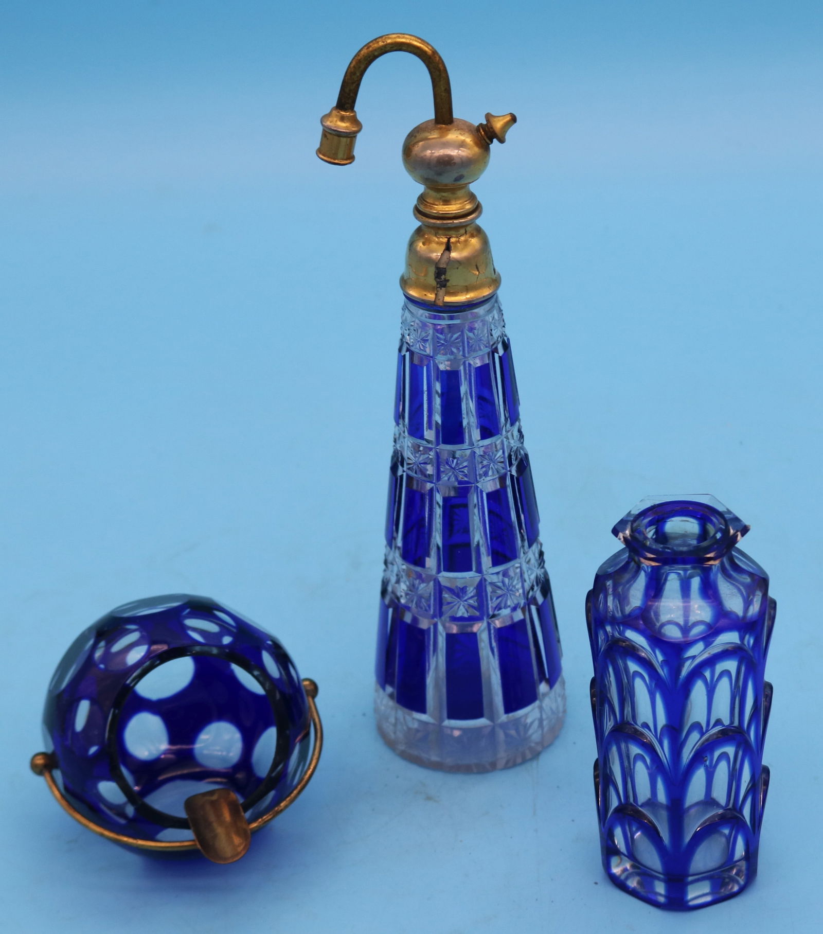 3 COBALT OVERLAY ITEMS, BACCARAT PERFUME WITH AS: IS TOP 8 1/2" H, 4 1/2" BOTTLE, 3" BALL SHAPED ASH TRAY