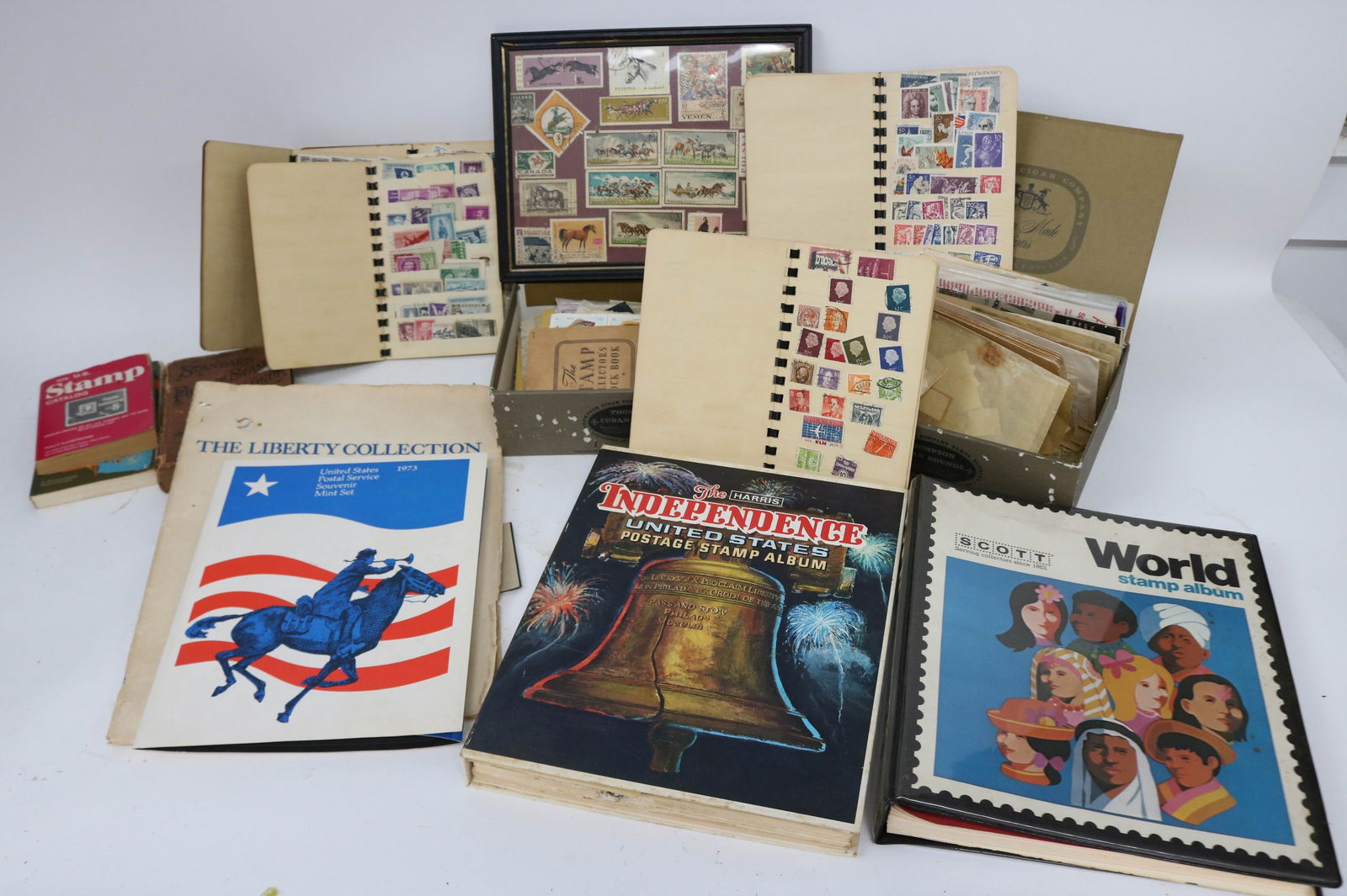 ESTATE COLLECTION OF POSTAGE STAMPS, ALBUM NOT: COMPLETE, SCOTT WORLD STAMP, MOSTLY EMPTY