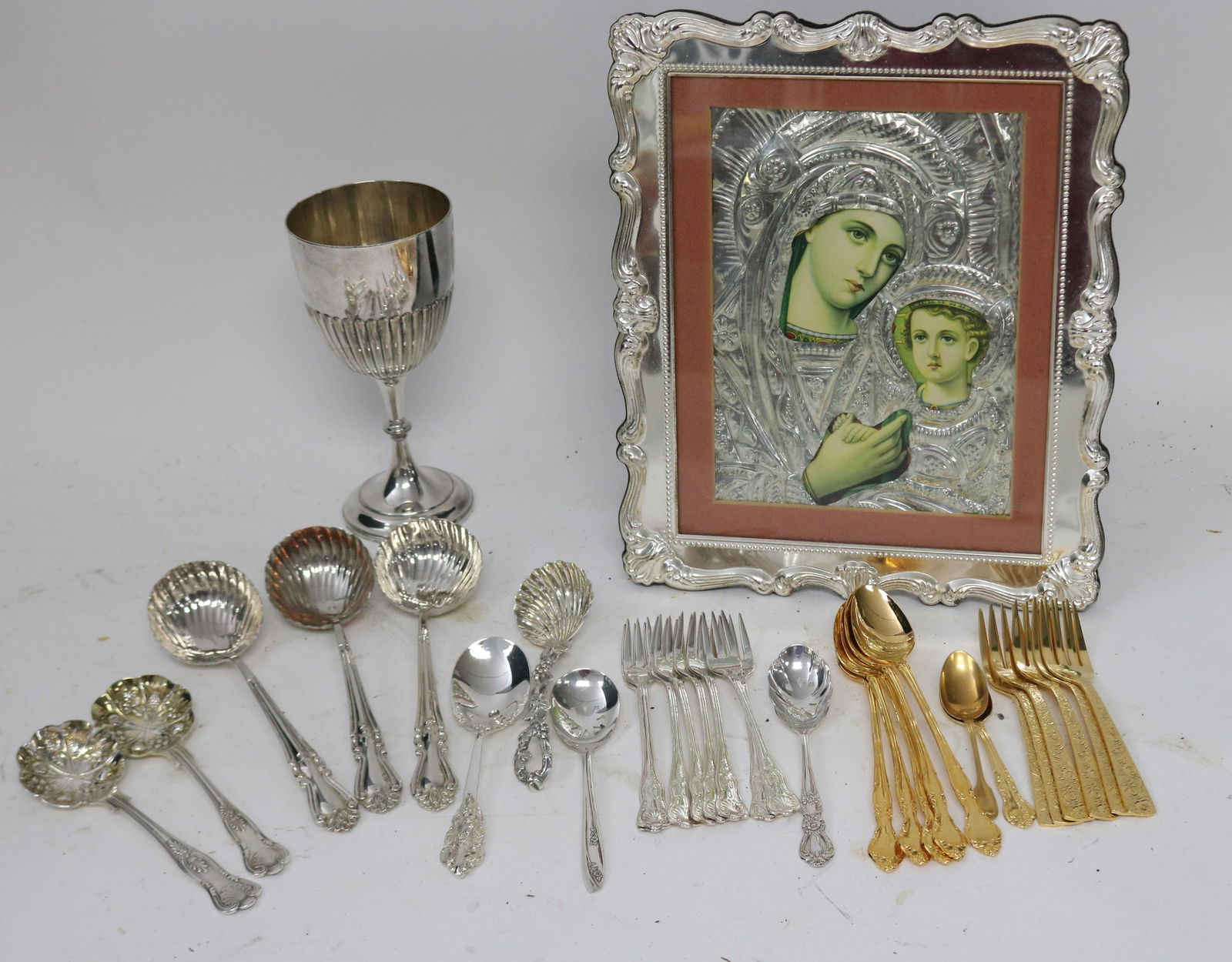 30 PCS. GOLD & SILVER PLATE, FRAME ICON 12" X: 10", ENGLISH PLATED GOBLET 7 1/2", 16 PCS. SILVER PLATED FLATWARE, 12 PCS. GOLD PLATED FLATWARE 4 1/2" - 8"