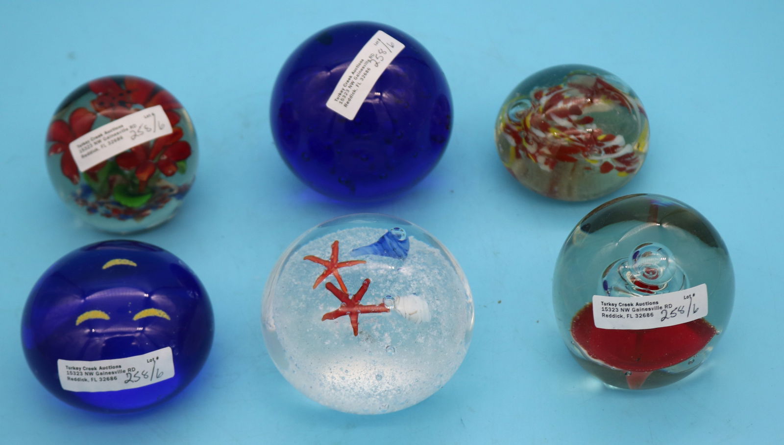 6 BLOWN GLASS PAPERWEIGHTS, BLUE SMILEY FACE HAS: 2 SMALL BRUISES