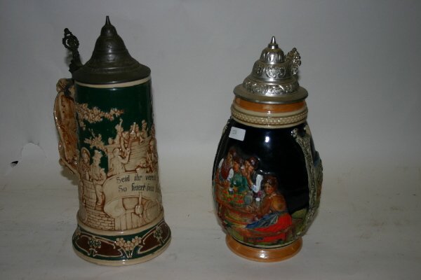 2 Old German Stoneware Steins: 2 Old German Stoneware Steins, embossed with pewter tops, 10 1/2" & 11 1/2"H