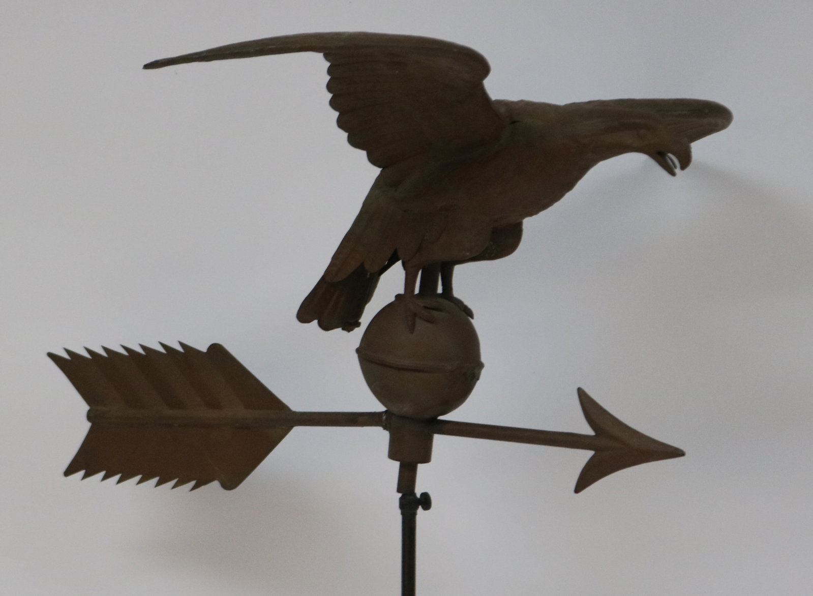 EAGLE WEATHERVANE WITH ARROW, COPPER, OLD FINISH,: EARLY 20TH C. SHOWS OLD REPAIRS & DENTS, 14 1/4" H, 25" L, 26 1/2" W