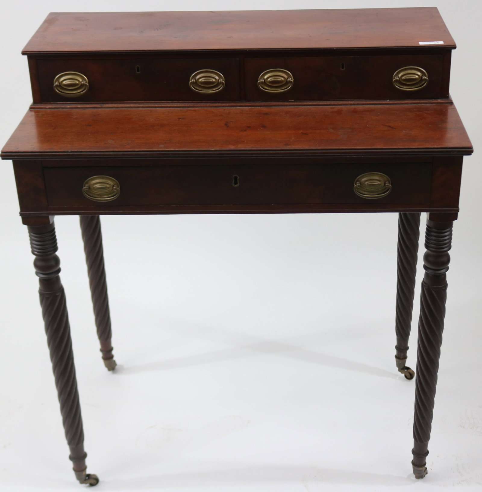19TH C. MAHOGANY DRESSING STAND, 2 DRAWER TOP: OVER SINGLE DRAWER, TURNED & ROPE TWIST LEGS, BRASS PULLS, OLD REFINISHED CONDITION, BRASS CASTERS, 36" H, 32" W, 18 1/2" D