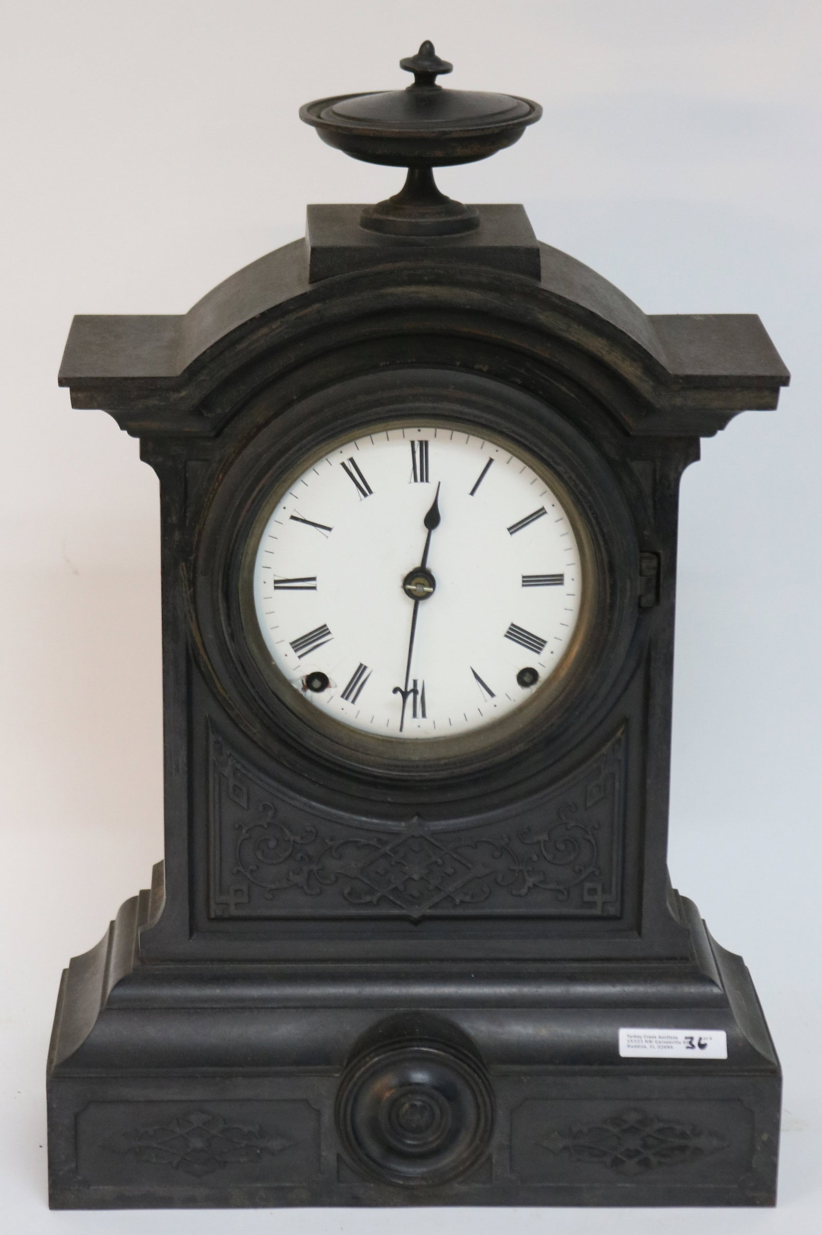 VICTORIAN CAST IRON SHELF CLOCK,: TIME & STRIKE, COVERED URN FINIAL, CURRENTLY WORKING BUT NOT GAURANTEED, 19" H, 12" W, 5" D