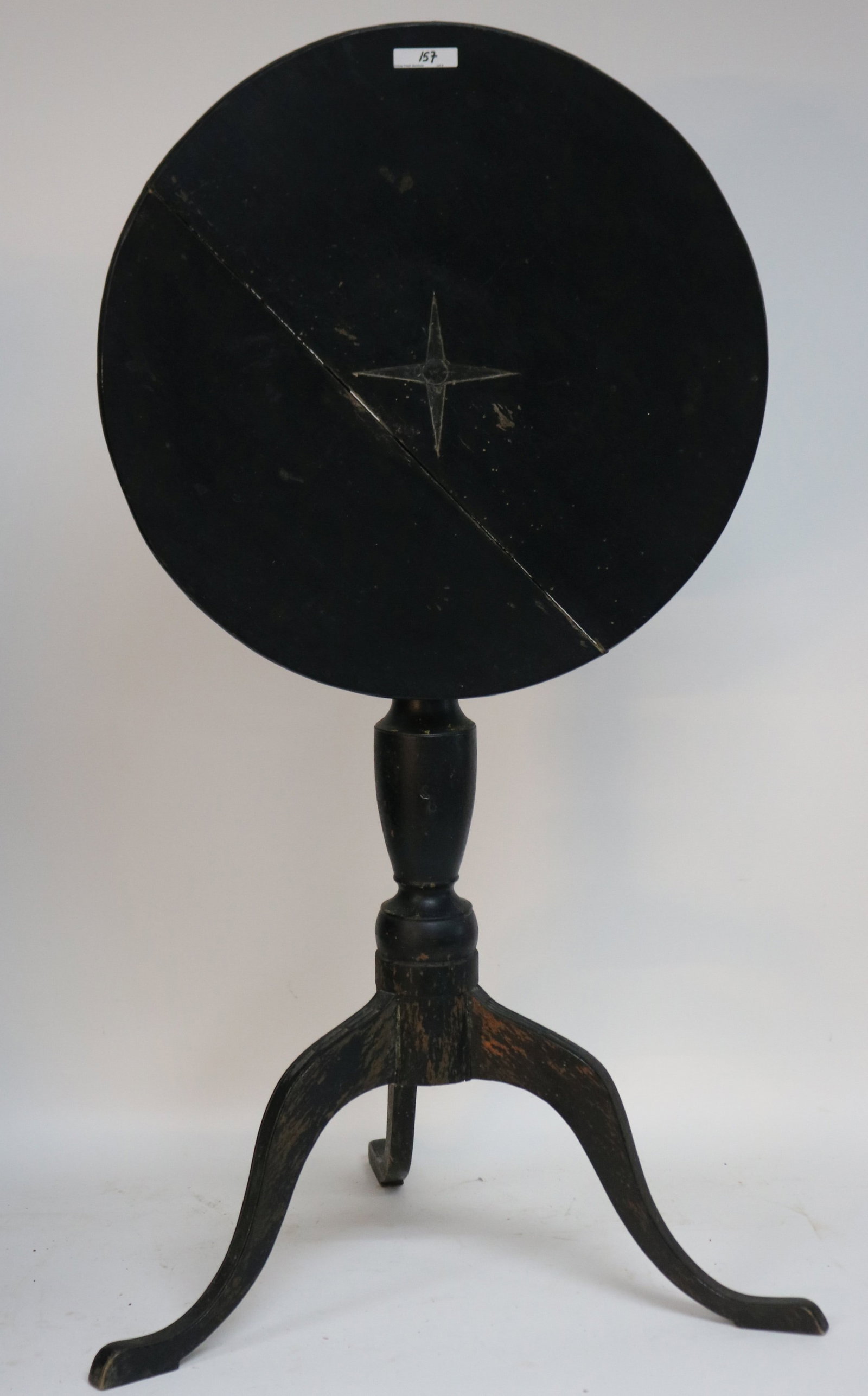 18TH C. QUEEN ANNE TIP TOP CANDLESTAND, STAR: CARVED TOP, TURNED SHAFT, CHIP CARVED CABRIOLE LEGS, BLACK PAINTED FINISH, TOP HAS CRACK, 26 1/2" H, 19" DIA., BASE 21 1/2"