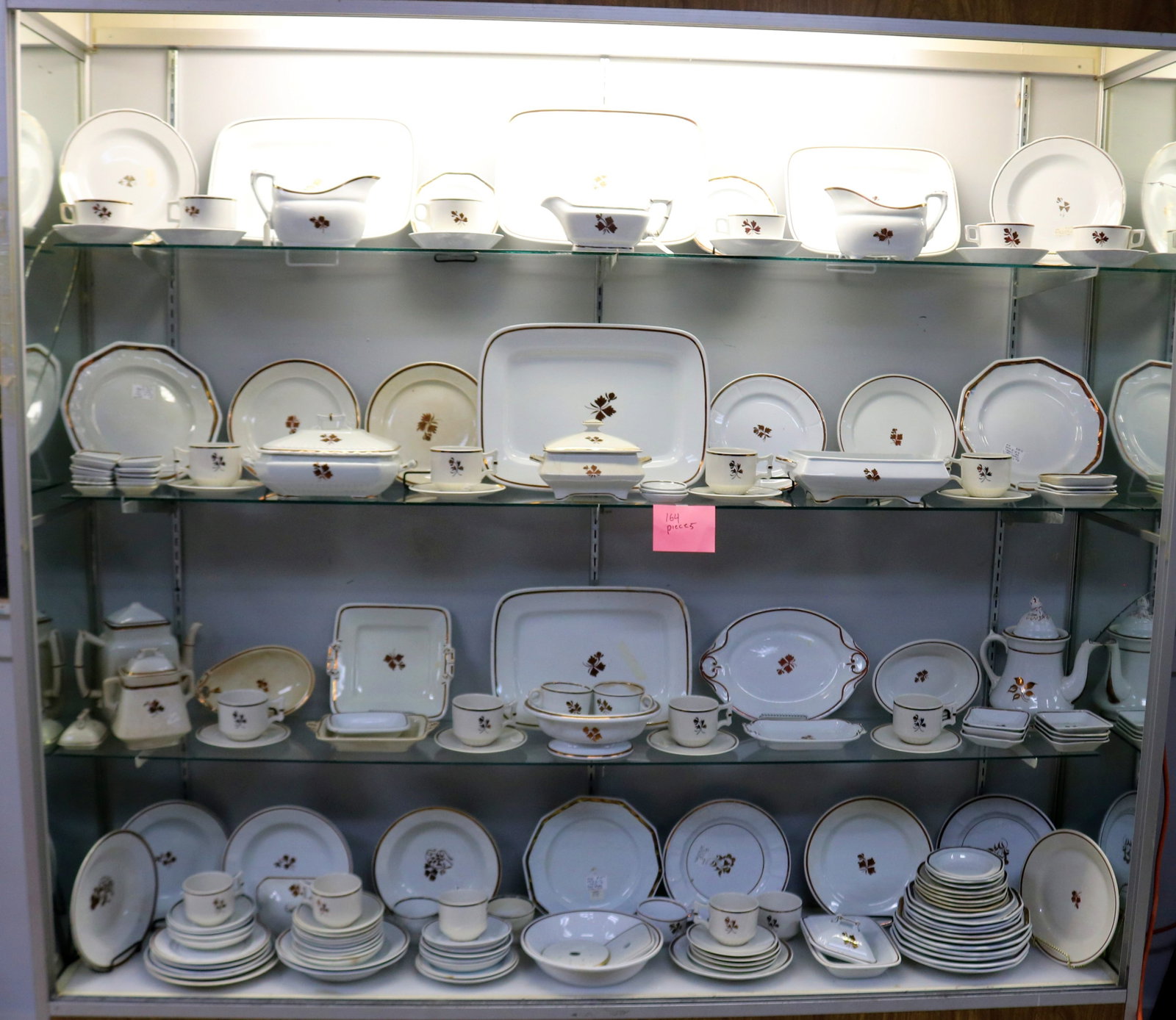 164 PCS. TEA LEAF LUSTRE BOWLS, PLATES, PLATTERS,: TEA POT, SUGAR BOWLS, GRAVY BOATS, ETC. SOME SHOW CHIPS, STAINS, ETC. 1/4" - 10" H, 3" - 15 3/4" W, MOST IN GOOD CONDITION