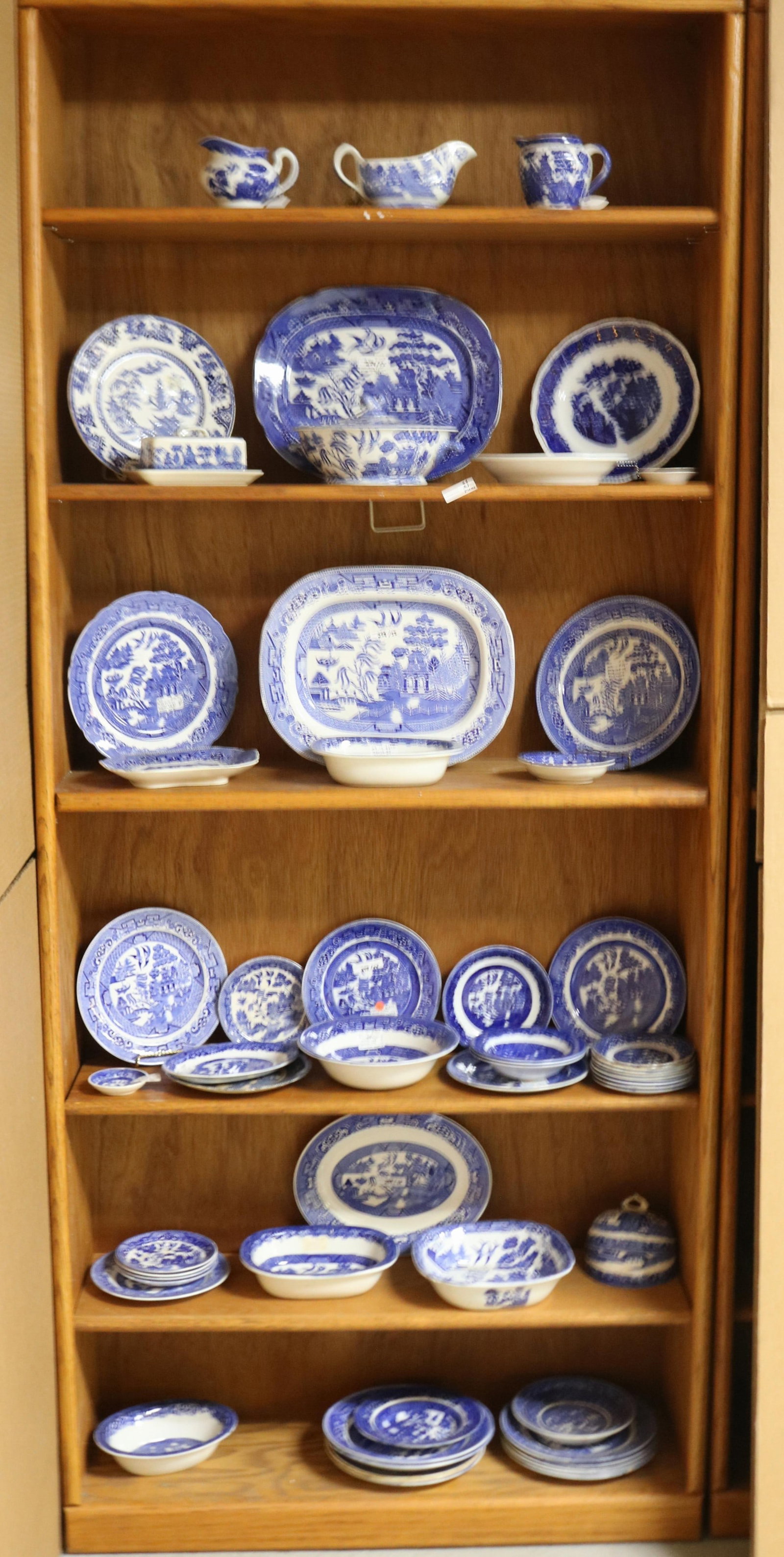 55 PCS. BLUE WILLOW CHINA, PLATES, PLATTER,: COVERED TUREEN, CREAMER, GRAVY BOAT, ETC. MOST IN GOOD CONDITION, ENGLISH & JAPANESE, 1/2" - 5" H, 3" - 14" W