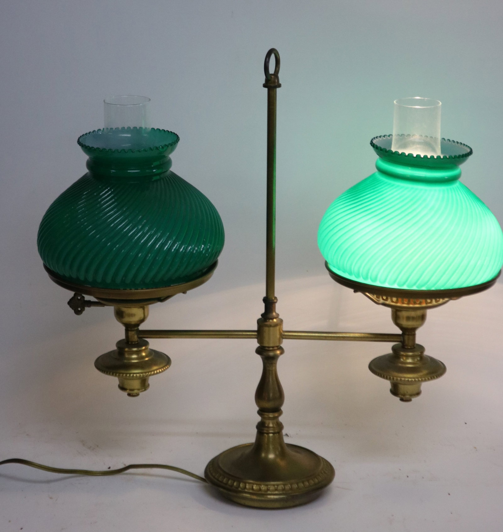 CONTEMPORARY BRASS DOUBLE STUDENT LAMP, GREEN: RIBBED SHADES, 1 SIDE NOT WORKING, 19 1/2" H, 19" W, 7" D