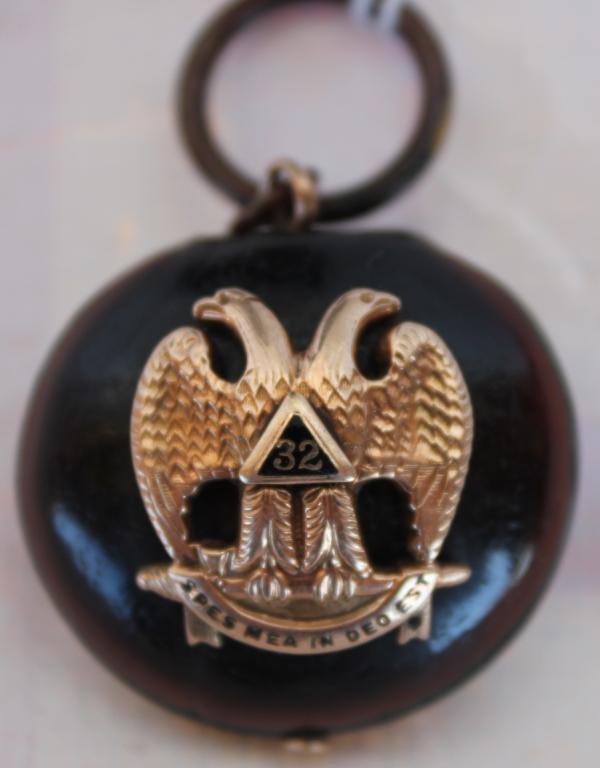GENTLEMAN'S 32ND DEGREE MASONIC FOB WITH: EMBOSSED RAISED DOUBLE EAGLE HEAD, EMBLEM ON REVERSE, GOLD DECORATIONS, MOUNTED ON CHESTNUT, 1 1/4" DIA.