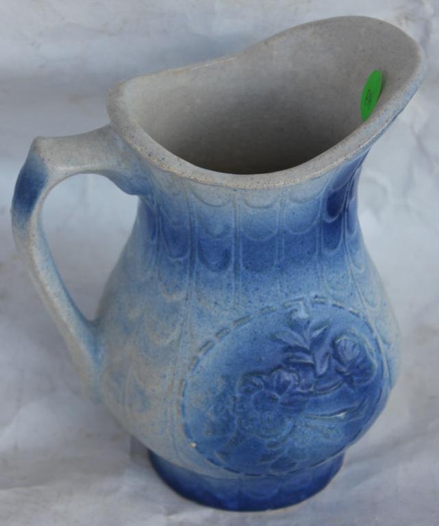 BLUE SPONGEWARE PITCHER WITH EMBOSSED: FLOWERS, TOGETHER WITH GRAY ENAMELED FUNNEL, APPROX. 7" H