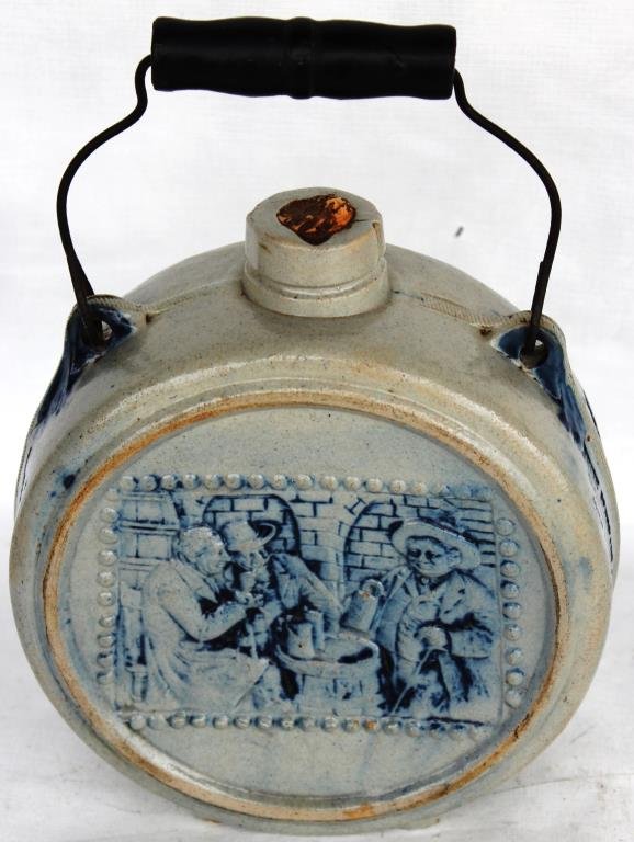 BLUE & WHITE SALT GLAZE ADVERTISING CANTEEN: WITH BEER DRINKING GENTLEMAN, "THE WHITE ELEPHANT SALOON, ALL FULL MEASURE, JOHN MCNEIL MANAGER", 10" H, 6 1/2" DIA.