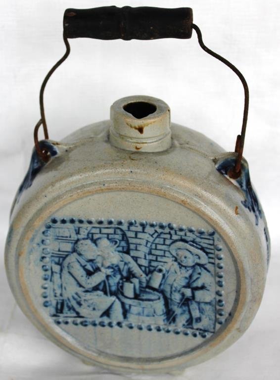 BLUE & WHITE STONEWARE ADVERTISING CANTEEN,: WITH 3 EMBOSSED GENTLEMAN, "GABE STAGGS SALOON, 2 DOORS FROM ALLEN'S MARKET, MCKINNEY, TEX.", 10" H, 6 1/4" DIA.
