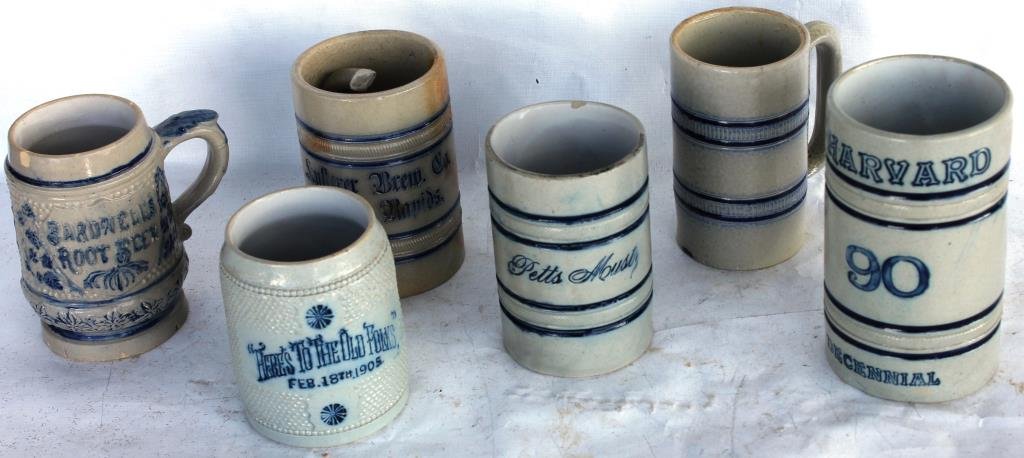 LOT OF 6 STONEWARE HANDLED MUGS,: SOME MOTTOS, INCLUDING HARVARD, HERE'S TO THE OLD FOLKS, PETTS MOUSTY, BARDWELLS ROOT BEER(CHIPPED) AND BREW COMPANY GRAND RAPIDS (BROKEN HANDLE) 4" - 5 3/4" H