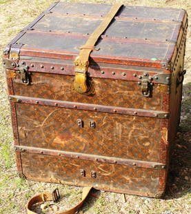 VINTAGE LOUIS VUITTON TRUNK IN AS FOUND CONDITION,: INTERIOR TRAY, REPLACED LOCK PLATE, SHOWS OVERALL WEAR, FRONT LEFT SHOWS CRACK NEAR LATCH, 25" H, 25" W, 24 1/2" D, INTERIOR CLEAN, HAS SHORTENED STRAP