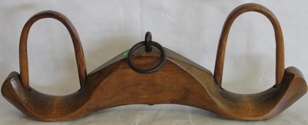 19TH C. CARVED MAPLE GOAT YOLK WITH IRON RING: 11" H, 29 1/2" W, 4 1/2" D