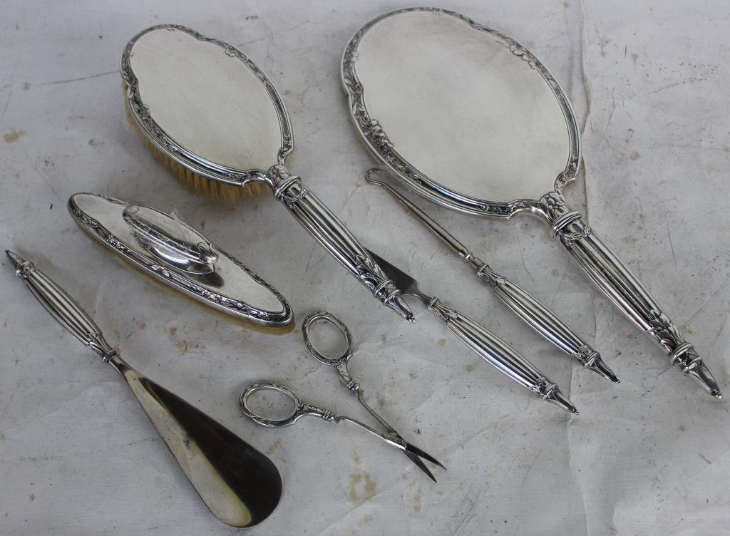 7 PC. STERLING SILVER DRESSER SET: TO INCLUDE MIRROR, BRUSH, BUFFER, BUTTON HOOK, SHOE HORN, SCISSORS, AND A FILE, 4 1/2" - 12 1/2" L