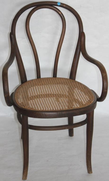 EARLY BENTWOOD ARM CHAIR SIGNED THORNET W/: CANED SEAT. 34"H X 22"W X 23"D