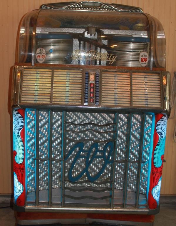 WURLITZER JUKEBOX-PLAYS 45 & 78 RECORDS: HI FIDELITY, MODEL #1550, OCCASIONALLY WORKING CONDITION, 2 FRONT GLASS PANELS SHOW 1 WITH A CRACK AND 1 WITH HALF DOLLAR SIZE PIECE MISSING. CASE IN GOOD CONDITION WITH KEYS._x000D_ 58"H X 38"W X 27