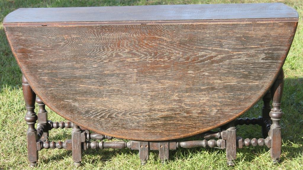 19TH C. OAK JACOBEAN STYLE DROP LEAF TABLE WITH: SWING LEGS, 30"H X 57"W X 65"L, ORIGINAL DARK FINISH