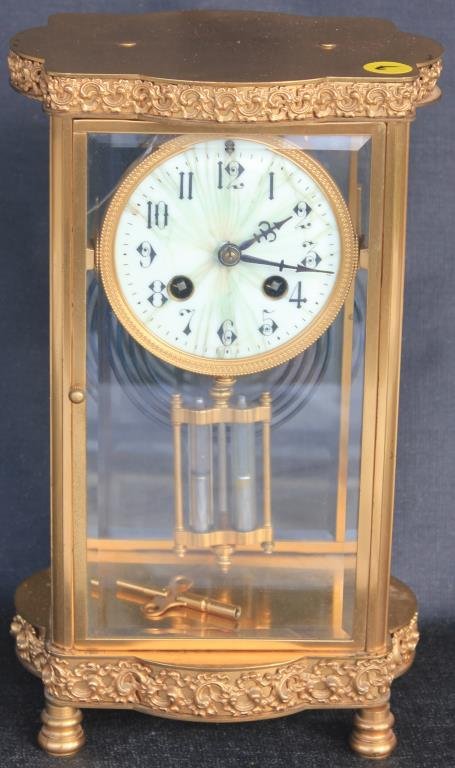 ORNATE BRASS AND GLASS CRYSTAL REGULATOR CLOCK: WITH AS FOUND ENAMEL DIAL, FRONT DOOR SHOWS CRACK, FRENCH MADE. 11"H X 7"W X 5 1/2"D