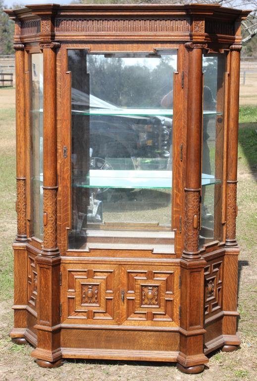 EXCEPTIONAL TIGER OAK DISPLAY CABINET: WITH COLUMNS, MIRROR BACK, PLATE GLASS SHELVES, LOWER PANEL WOODEN DOORS, REFINISHED CONDITION, SMALL CRACK TO FRONT GLASS, LOWER LEFT, 70" H, 49 3/4" W, 21" D
