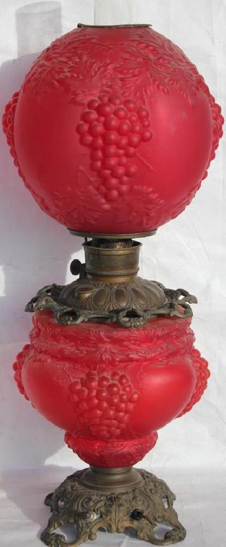 19TH C. RUBY SATIN GLASS GONE WITH THE WIND LAMP,: EMBOSSED GRAPE & LEAF, NEED REWIRING, 24" H