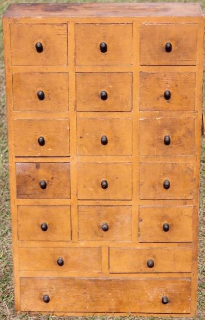 EARLY 20TH C. 18 DRAWER APOTHECARY STYLE CABINET,: NAILED CONSTRUCTION, PUMPKIN PAINTED FINISH, SOME DAMAGE TO LOWER LEFT, 36" H, 21 1/2" W, 7 1/4" D