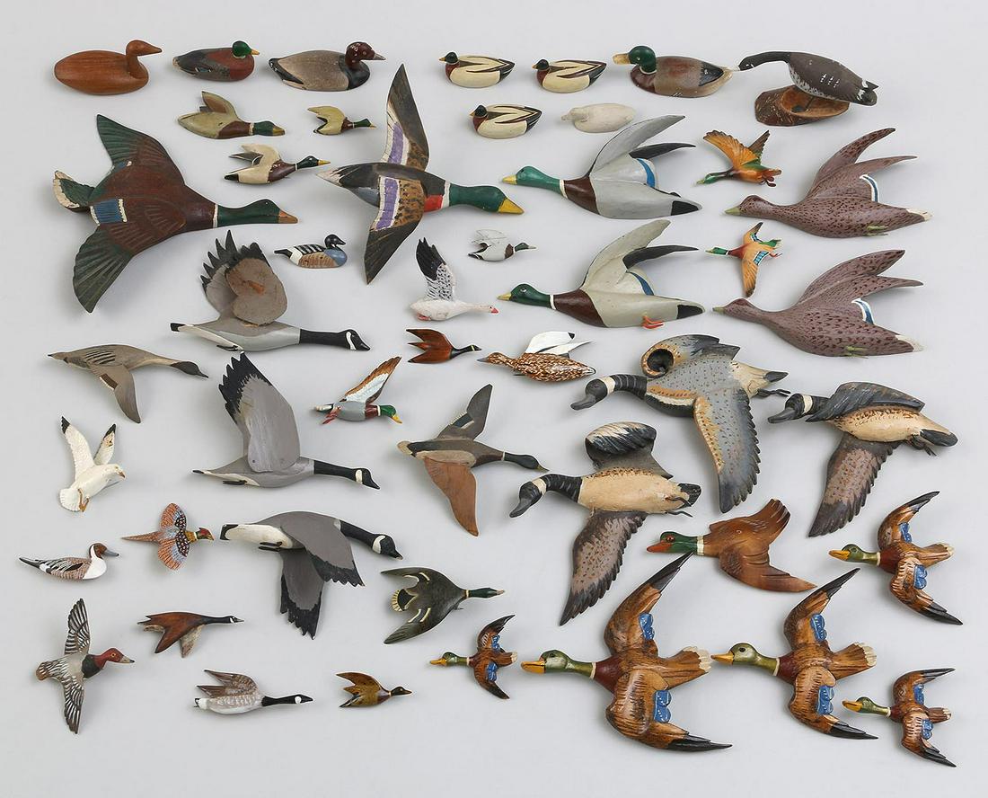 Large group of (50+) miniature ducks: Large group of (50+) miniature ducks including, most in flying positions, to be used as jewelry, displayed on the wall, or applied to dioramas, many marked ''W.R. McLean'', ''F.A. Faber'', ''J. White'