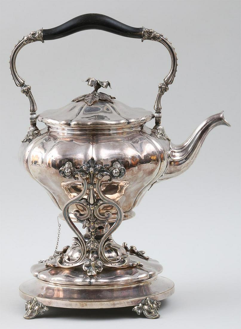 19th century, Christofle silverplate kettle: 19th century, Christofle silverplate hot water kettle with flower form finial to lid and swing handle, set on stand with burner and four scroll feet, marked on bottom of stand. Minor wear to plating a