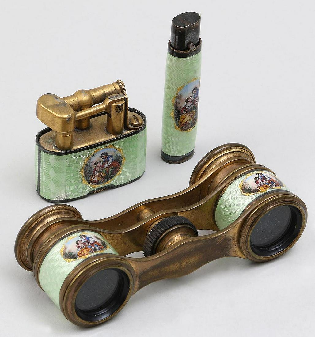 Three piece enamel accessory set: Three piece enamel accessory set with painted amorous couple scenes, to include: opera glasses; lighter (chip to enamel); and lipstick. Wear from use. Opera glasses 3-1/4''l.