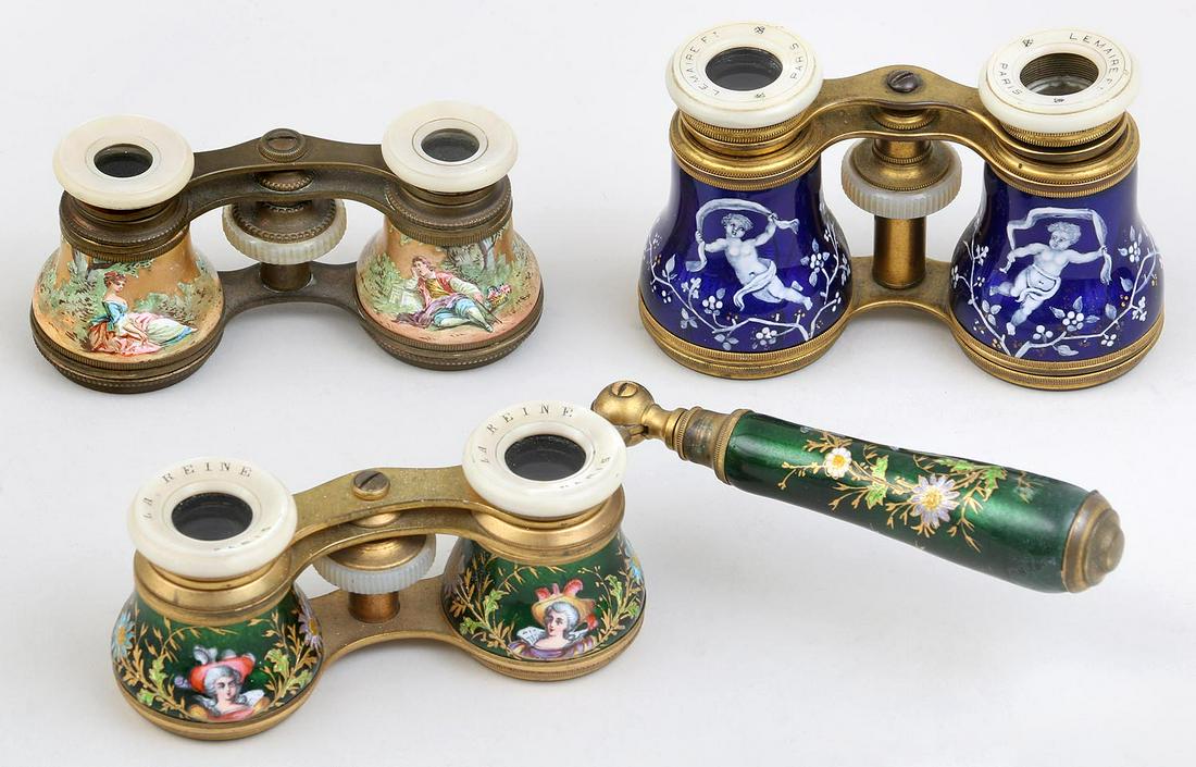 Group of (3) enameled opera glasses: Group of (3) enameled opera glasses with mother of pearl sights, to include: pair of blue enameled Lemaire with putti and gilt highlights (flake to one sight, spider cracks, bridge misshapen); pair of