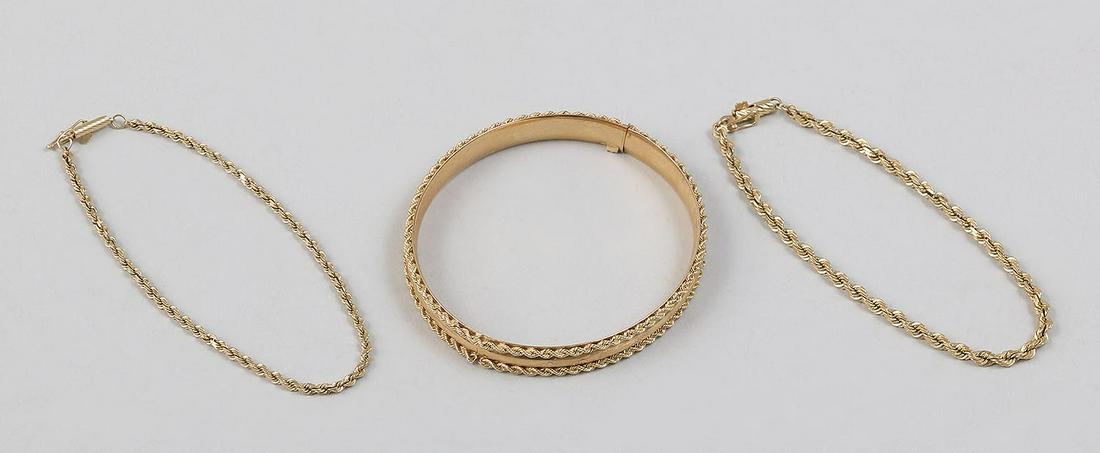 Group of (3) 14k gold bracelets: Group of (3) 14k gold bracelets, to include: (2) rope chains; and a bangle. Longest 8''l. Total approximate weight 15.0 dwt.