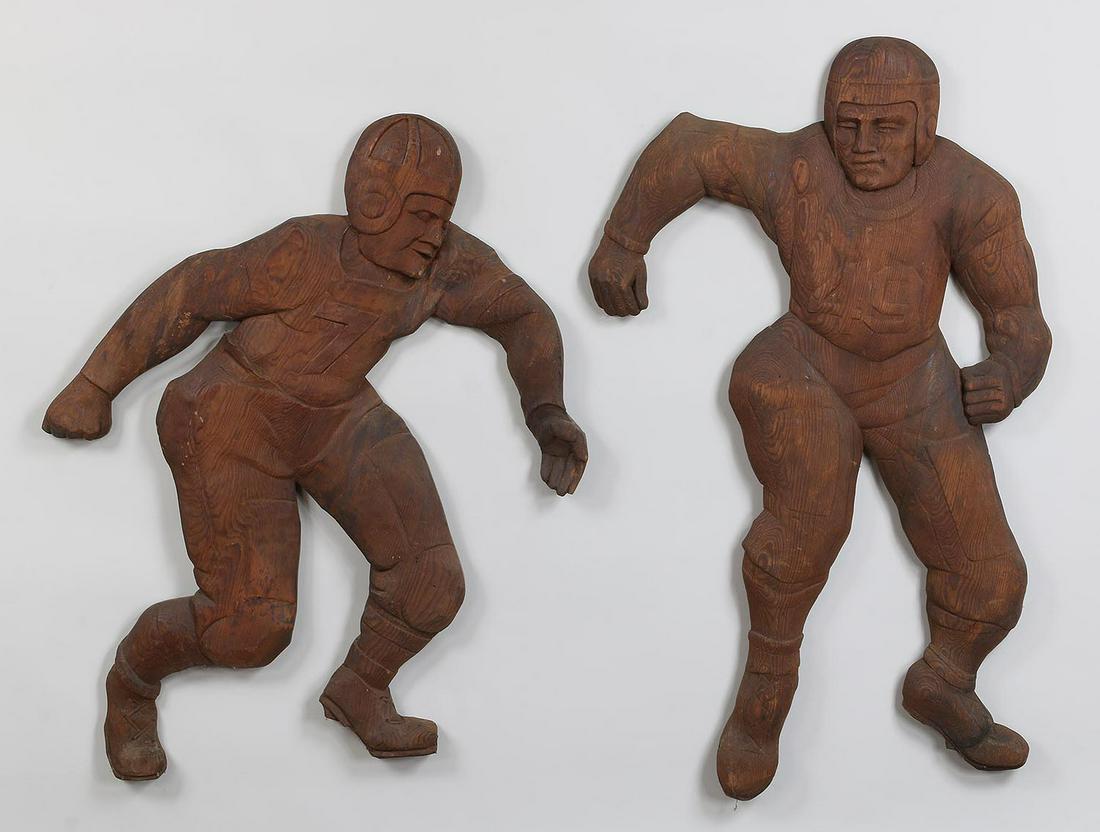 Pair of carved wood cutout football players (1 of 10)