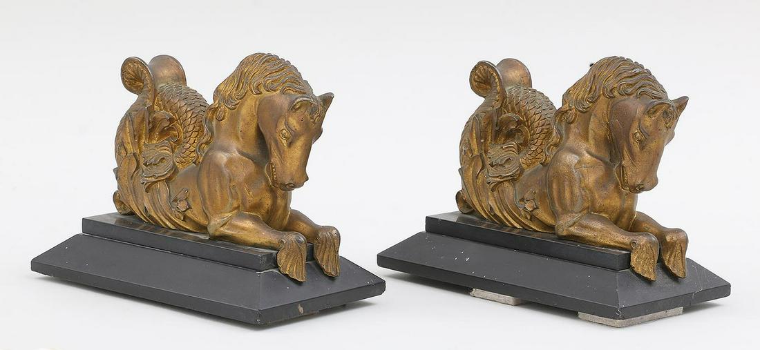 Pair of gilt bronze hippocampus: Pair of gilt bronze hippocampus (sea horse) garnitures set on slate bases. Wear to gilding, minor chips to bases. 5''h, 3-3/4''w, 6-1/2''d.