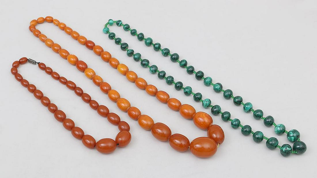 Group of (3) beaded necklaces: Group of (3) beaded necklaces, to include: (2) amber; and one malachite. Wear from use. Clasped amber necklace 17''l.