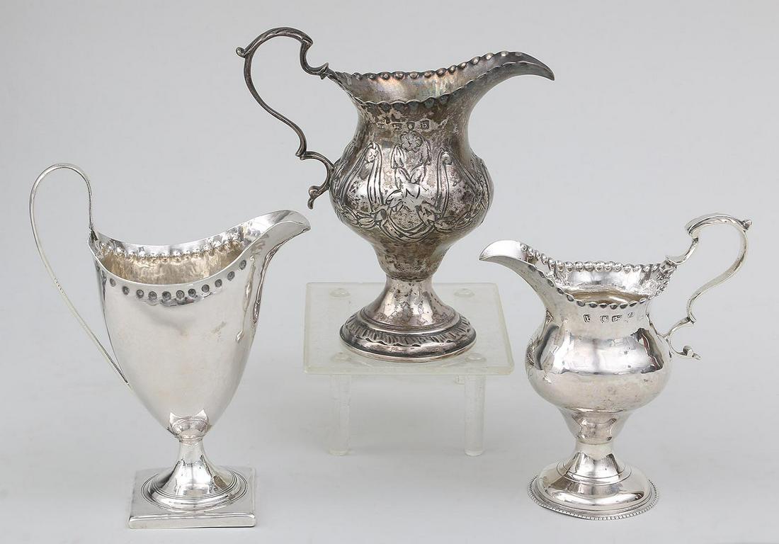 Group of (3) 18th century Bateman family sterling: Group of (3) 18th century Bateman family sterling silver footed creamers, to include: floral repousse, hallmarked for Hester Bateman, London, 1777; scalloped rim, hallmarked for Hester Bateman, London