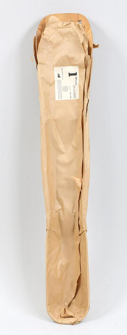 Charles & Ray Eames wood leg splint: Charles & Ray Eames wood leg splint manufactured by Evans Products Company, in original paper. 41-1/4''l, 8''w, 3-1/2''d.