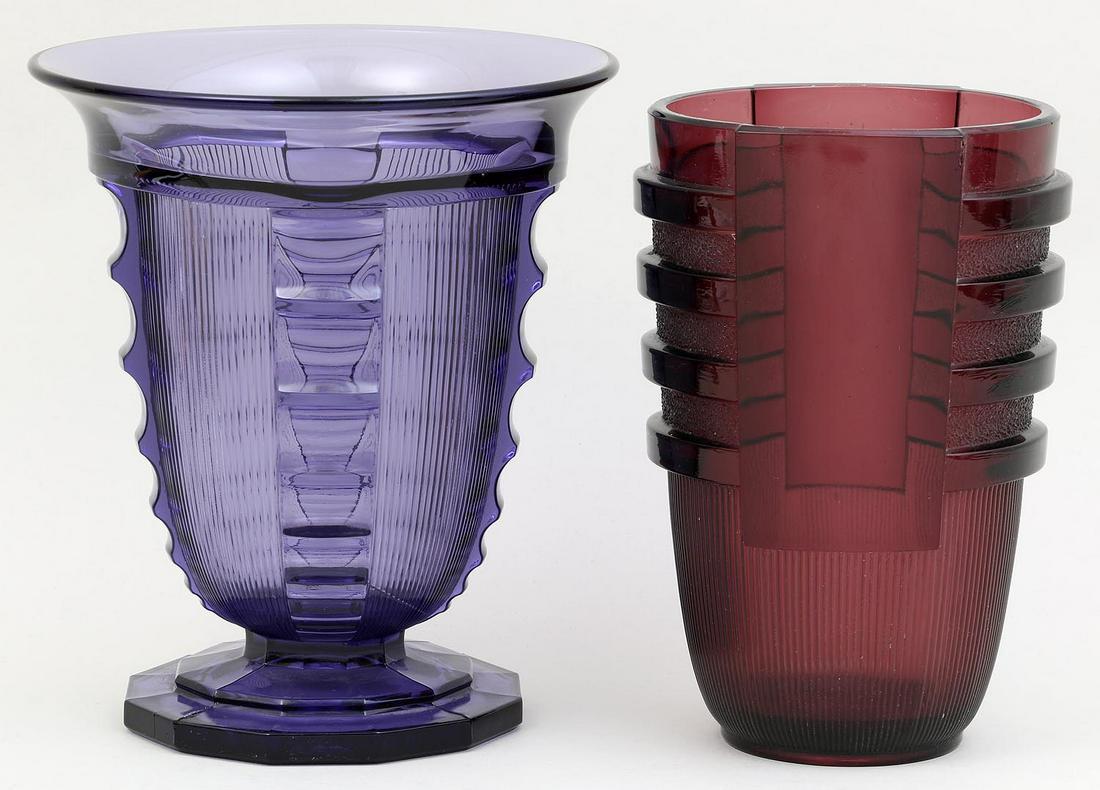 Group of (2) glass Val St. Lambert Art Deco vases: Group of (2) glass Val St. Lambert Art Deco vases, to include: footed purple vase, (firing imperfections); and maroon vase with linear pattern, (flake to rim). Both marked. Footed vase 7-1/2''h.