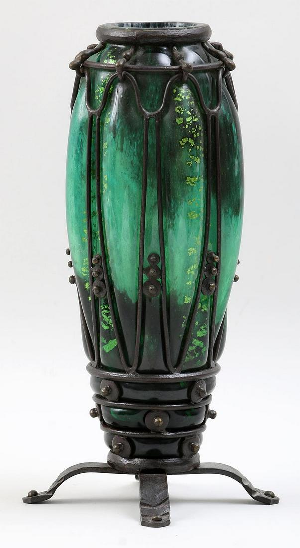 Daum Nancy, Marjorelle caged glass vase: Daum Nancy, Marjorelle caged glass vase on four iron feet, signed. 12-1/2''h.