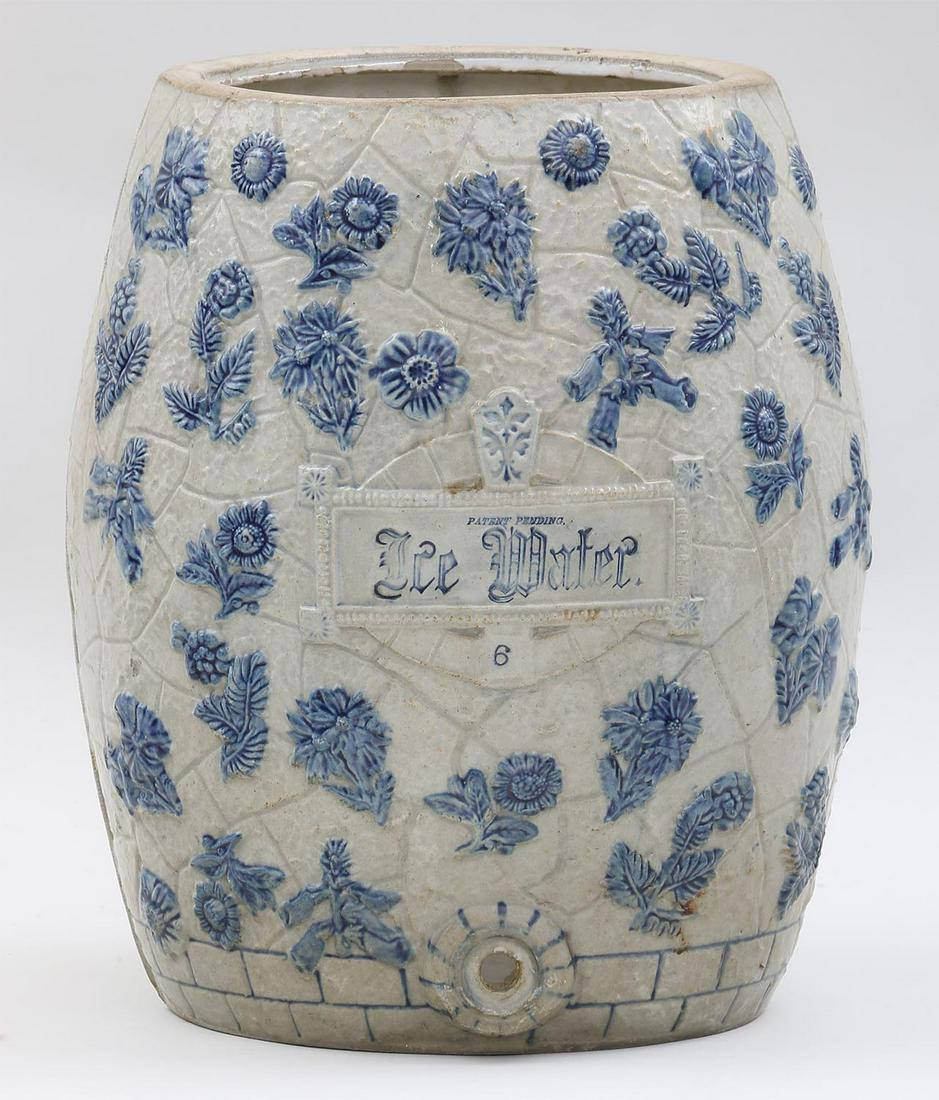 19th century American stoneware ice water cooler: 19th century American stoneware ice water cooler with cobalt floral decoration and bouquet to verso. Hairlines, chip to top interior rim, lacking lid and spigot. 16''h.
