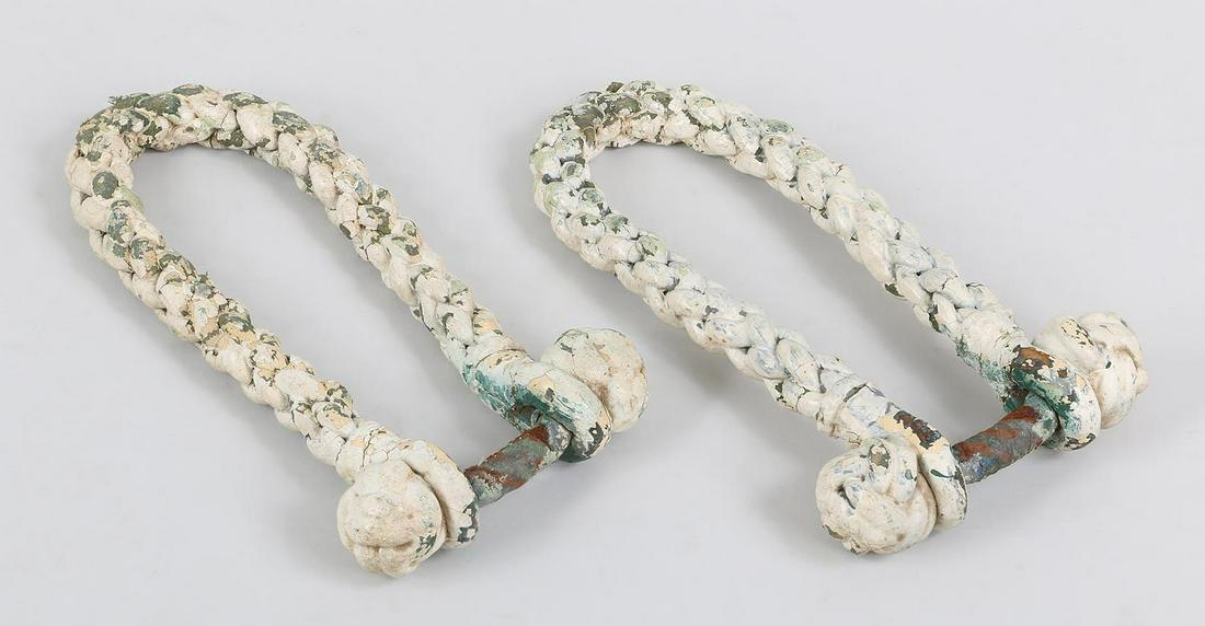 Pair of 19th century sailor made beckets: Pair of 19th century sailor made knotted sea chest beckets in white. Wear from use. 11''l, 6-1/2''w.