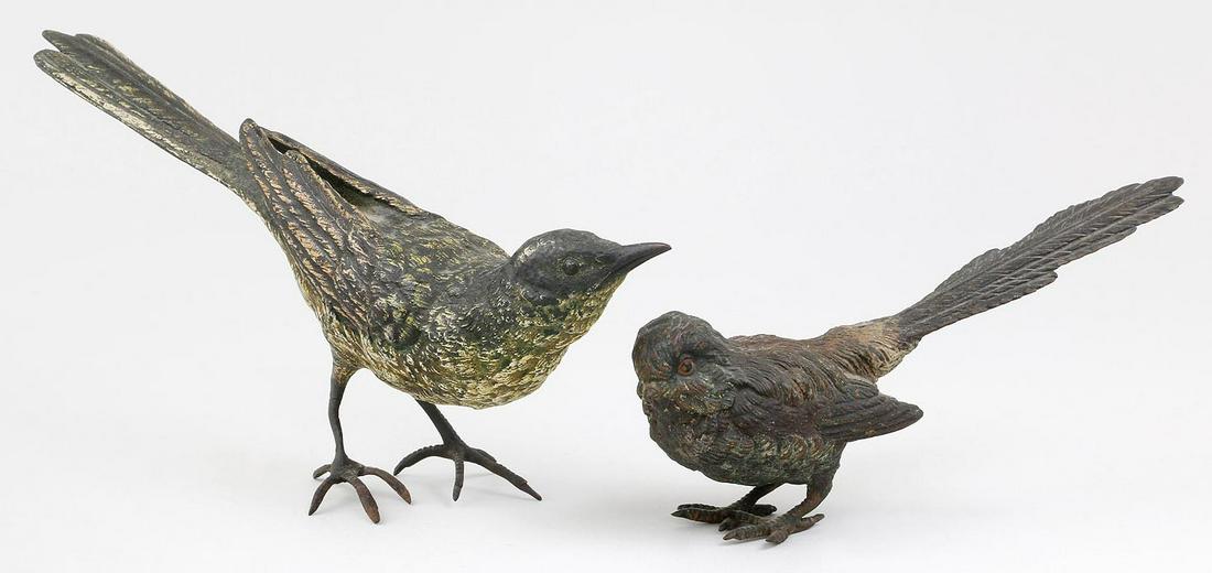 Group of (2) Austrian bronze birds: Group of (2) Austrian bronze birds, to include: Oriole with long tail; and small long tailed brown bird, stamped ''Austria''. Wear to paint. Largest 3-1/4''h, 2''w, 7''d.