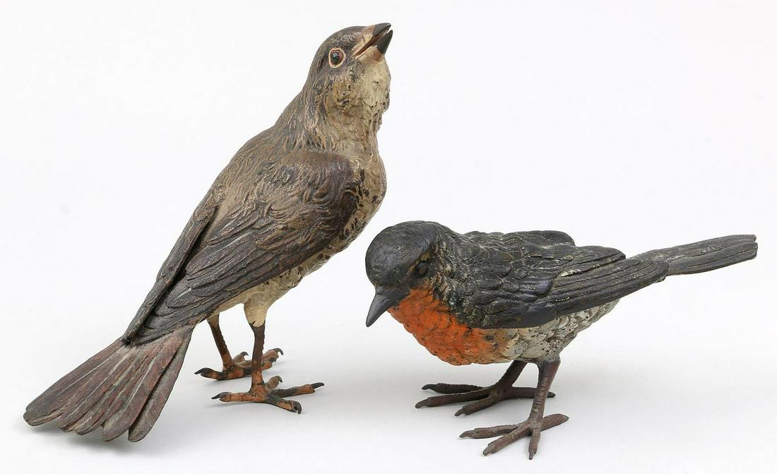 Group of (2) Austrian bronze birds: Group of (2) Austrian bronze birds, to include: robin with orange plumage; and one brown. Both stamped, ''Geschutz.'' Minor wear to paint. Larger 4''h, 2''w, 5-1/2''d.