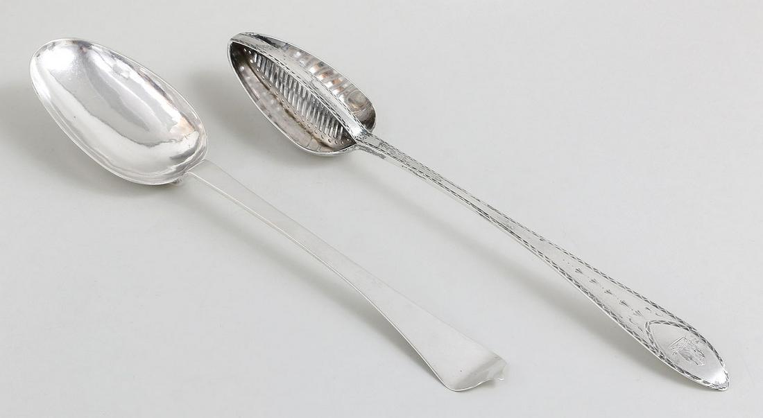 Group of (2) 18th century American silver spoons: Group of (2) 18th century American silver spoons, to include: sterling straining spoon, marked ''IW''; and coin serving spoon, marked for Amos Munson, New Haven, Connecticut. Wear from use. 13''l. Tot