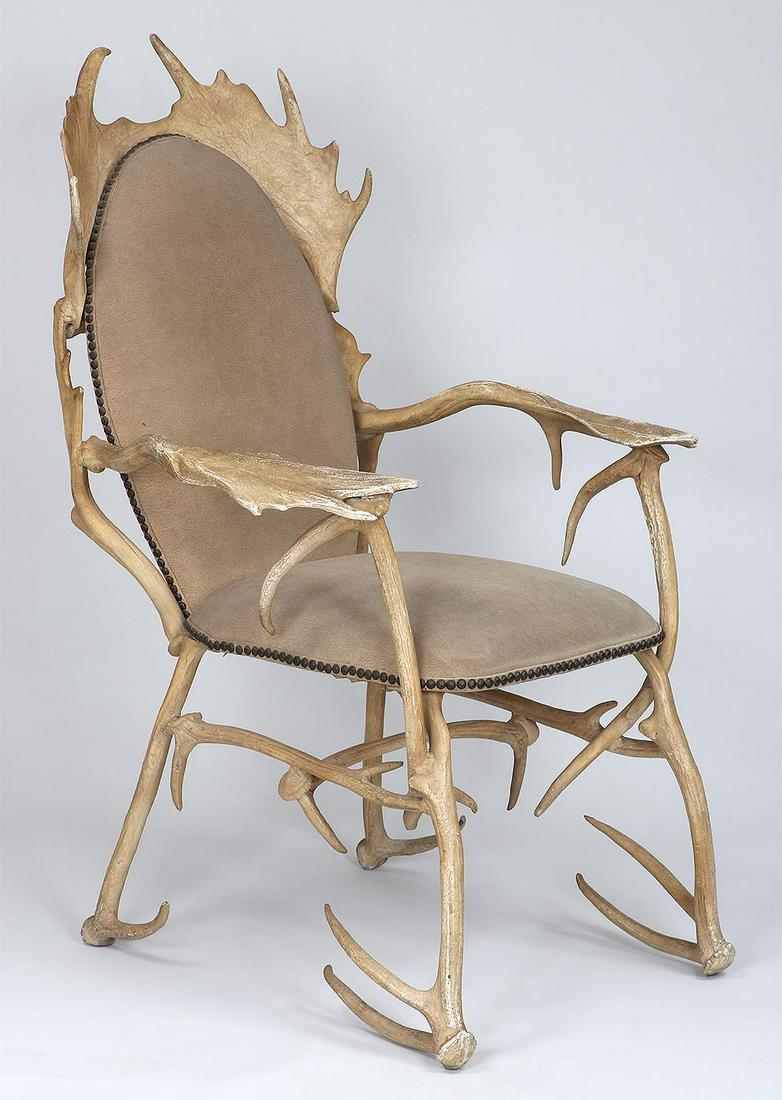 ARTHUR COURT (American, 1928-2015): ARTHUR COURT (American, 1928-2015), antler chair, cast aluminum with leather upholstery. Wear to paint from use. 41-1/2''h, 28''w, 32''d.