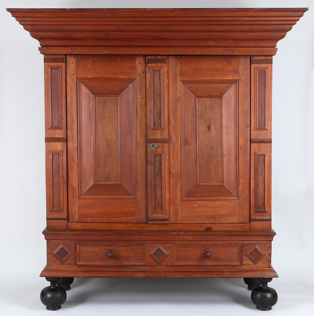 18th century Hudson Valley gumwood kas: 18th century New York Hudson Valley gumwood kas with bold crown, two doors opening to two large shelves and upper half shelf, single long drawer, set on ball front feet and half ball back feet. 81-1/2