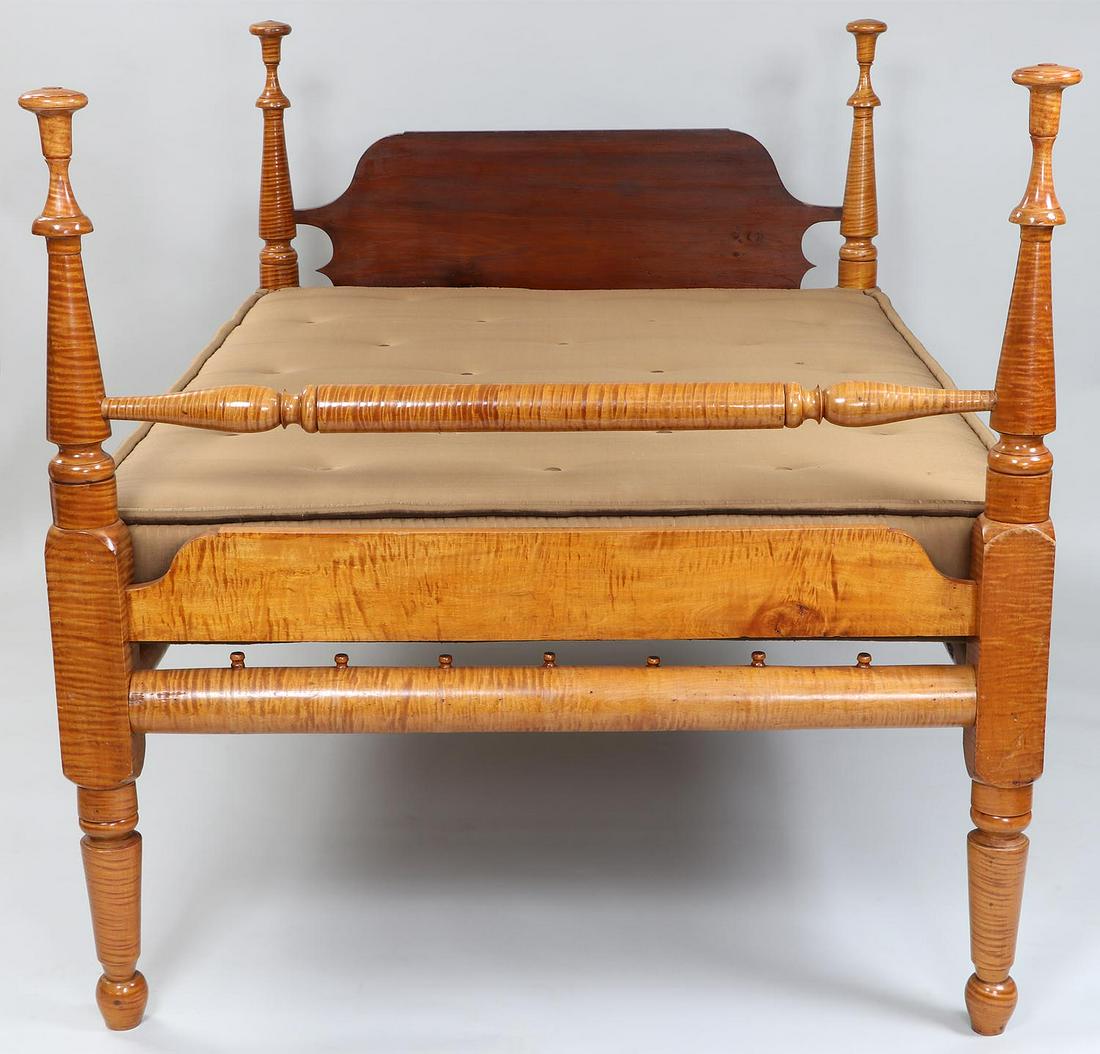 19th century American tiger maple rope bed: 19th century American tiger maple rope bed. Mahogany headboard. Overall 52''h, 51-1/2''w, 76''l; fits mattress size 52''w, 68''l.